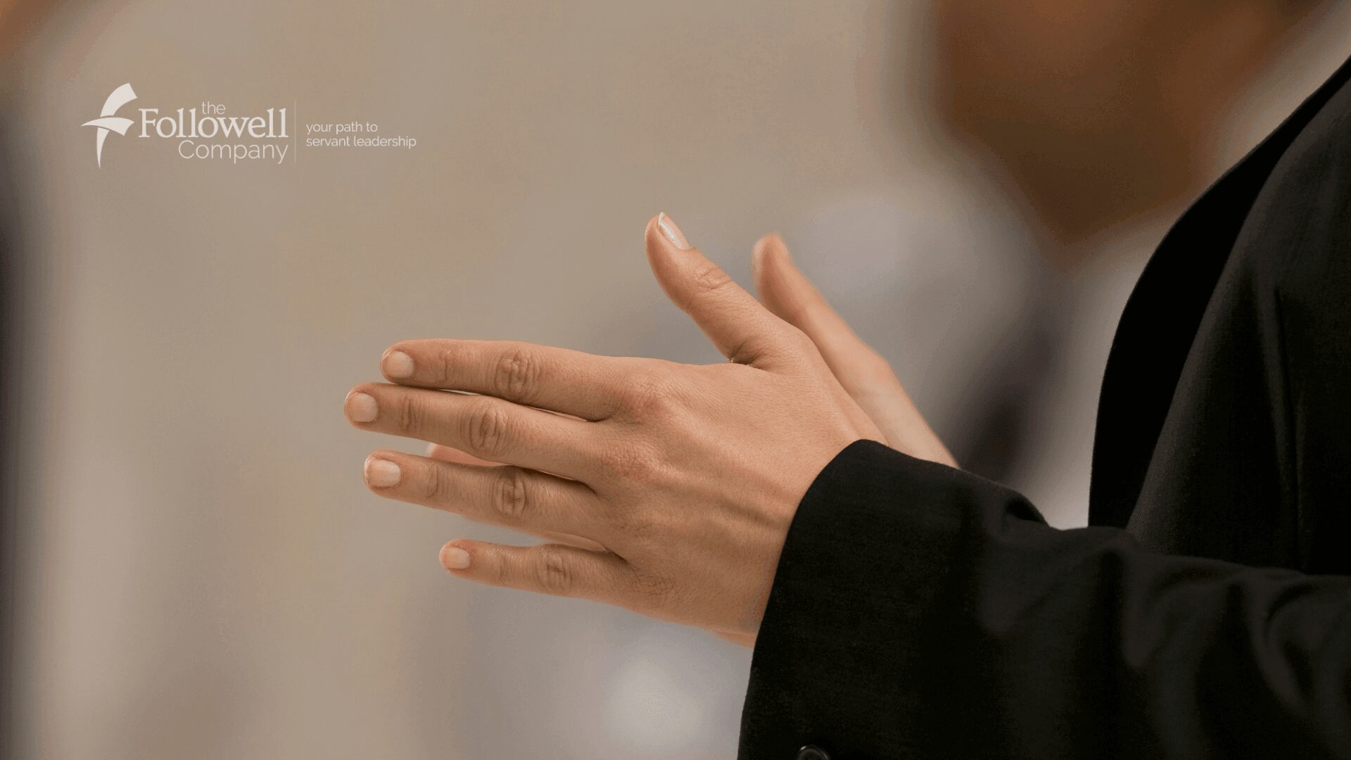 Close-up of hands in motion, possibly clapping or gesturing.